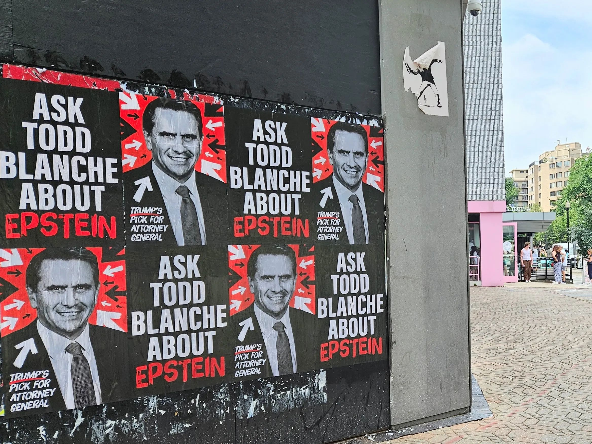 Home of the Brave “Ask Todd Blanche about Epstein” posters wheat-pasted on walls and storefronts around Washington, DC.