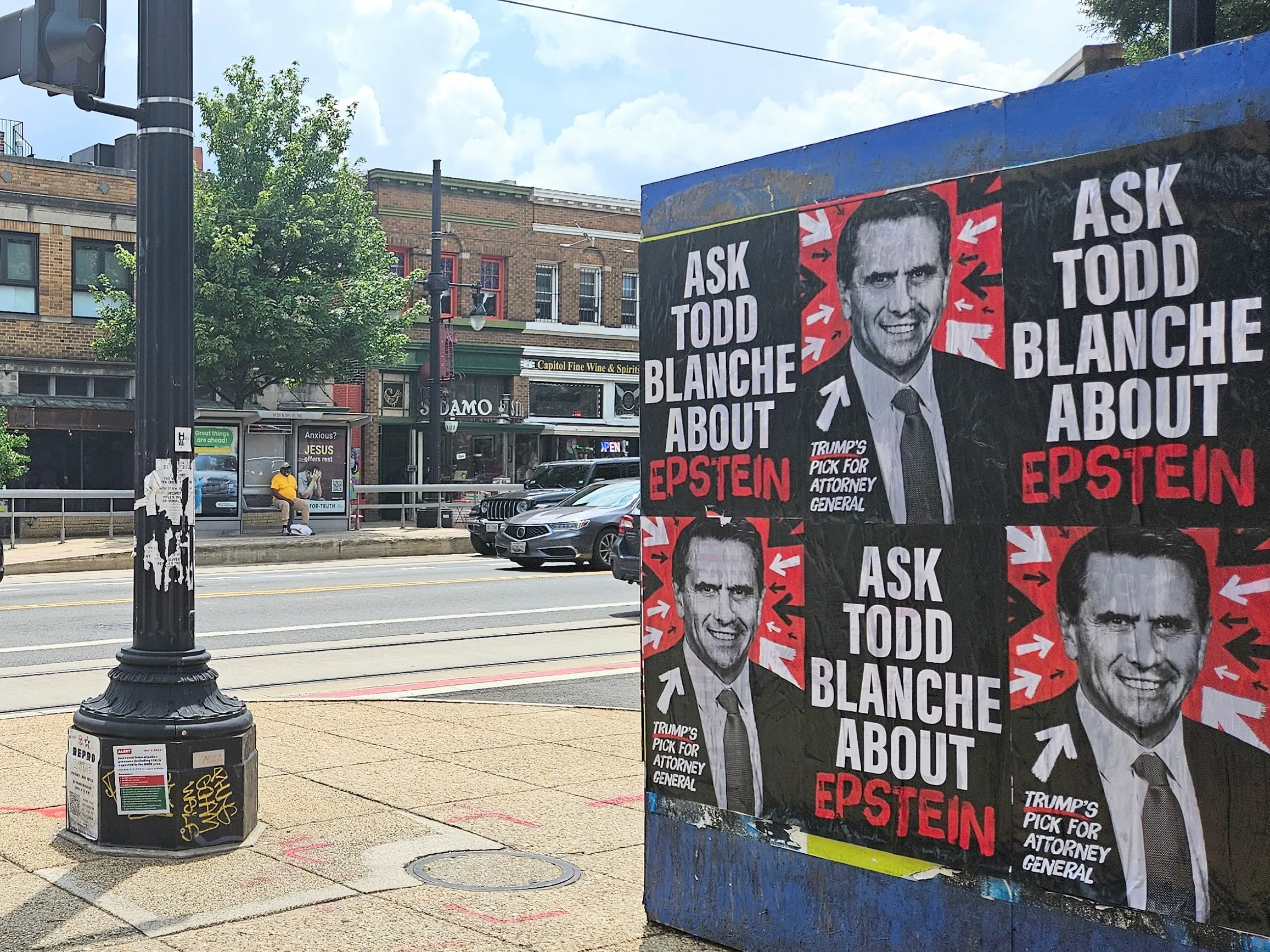 Home of the Brave “Ask Todd Blanche about Epstein” posters wheat-pasted on walls and storefronts around Washington, DC.