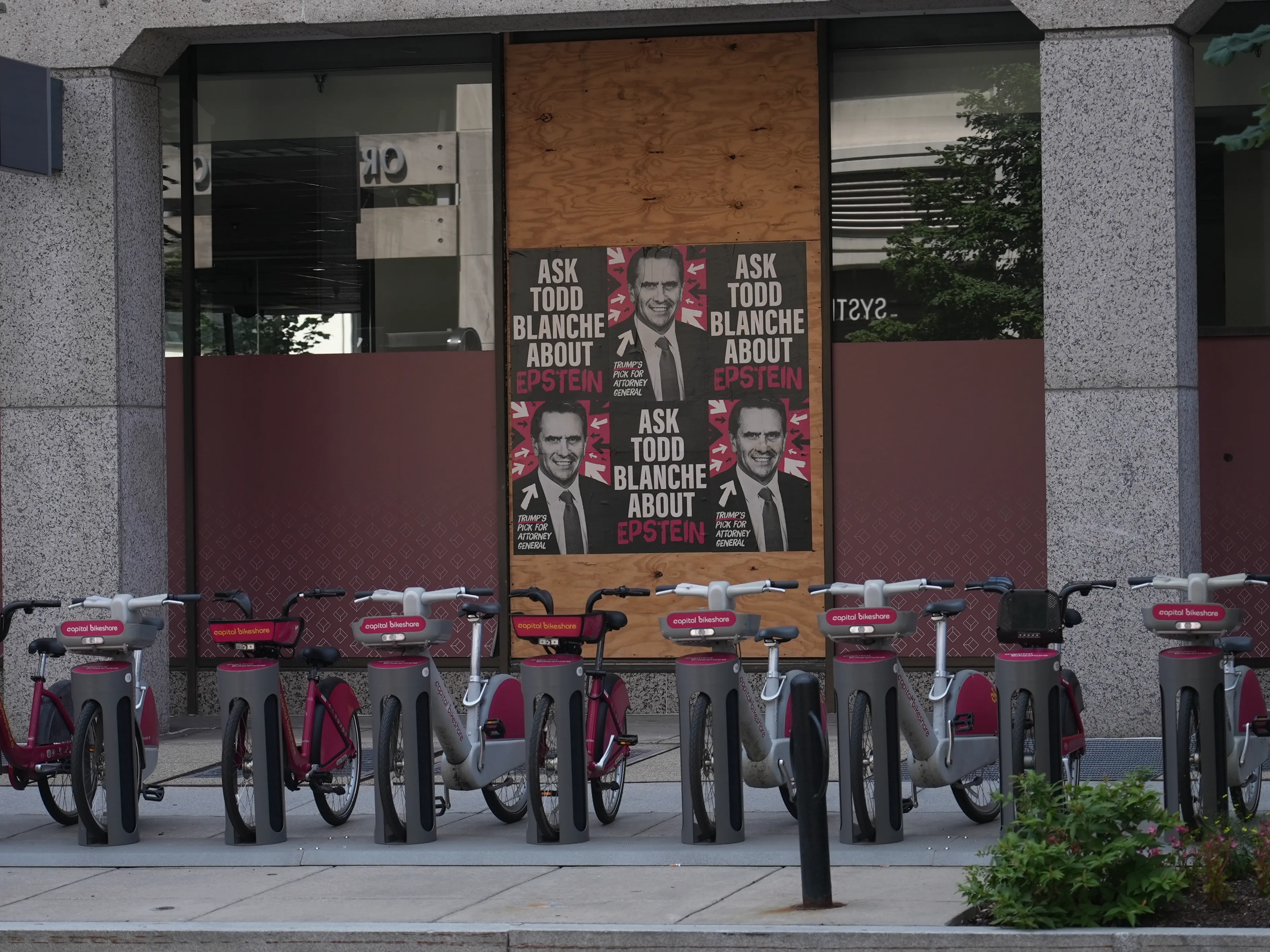 Home of the Brave “Ask Todd Blanche about Epstein” posters wheat-pasted on walls and storefronts around Washington, DC.