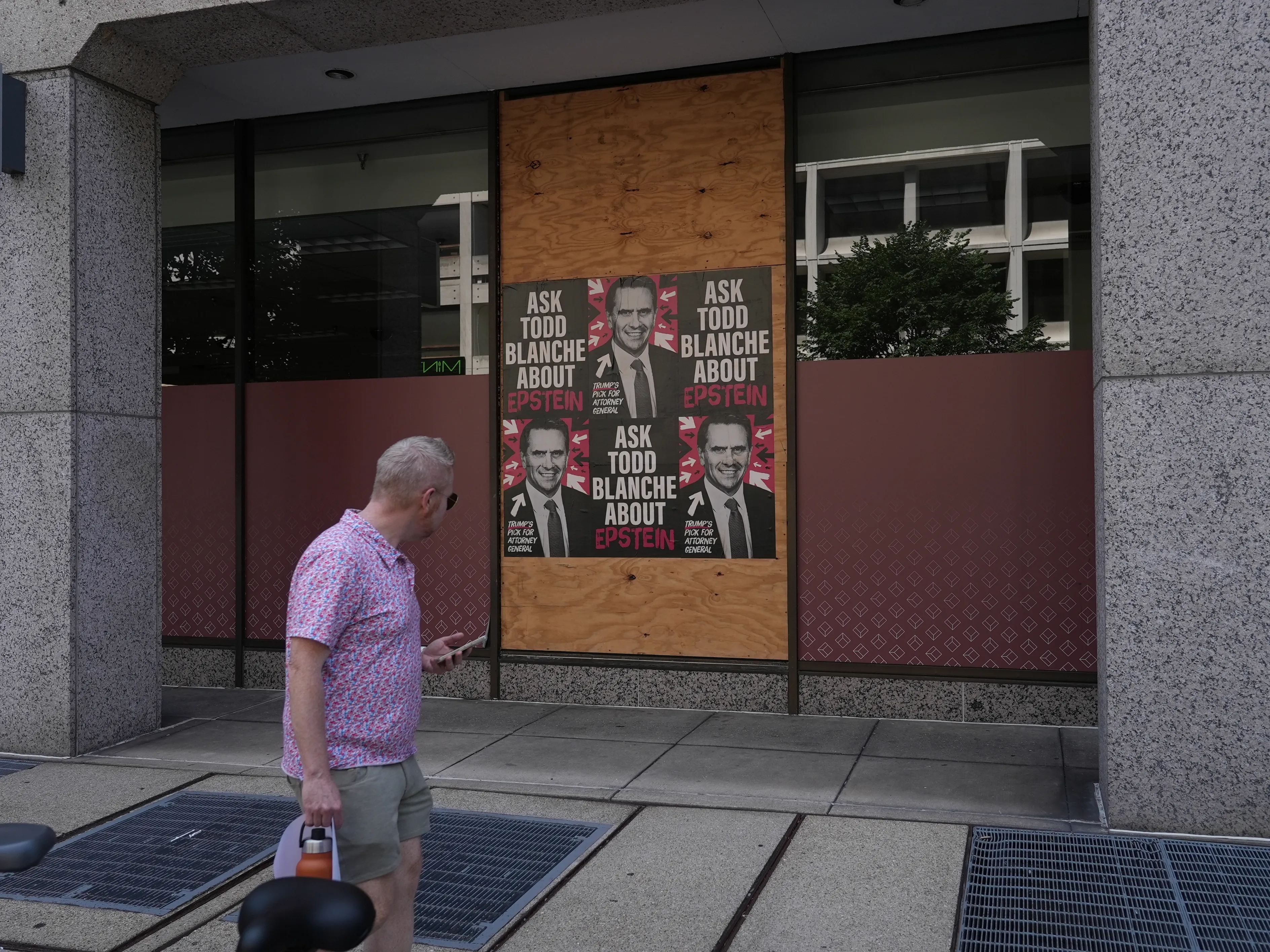 Home of the Brave “Ask Todd Blanche about Epstein” posters wheat-pasted on walls and storefronts around Washington, DC.